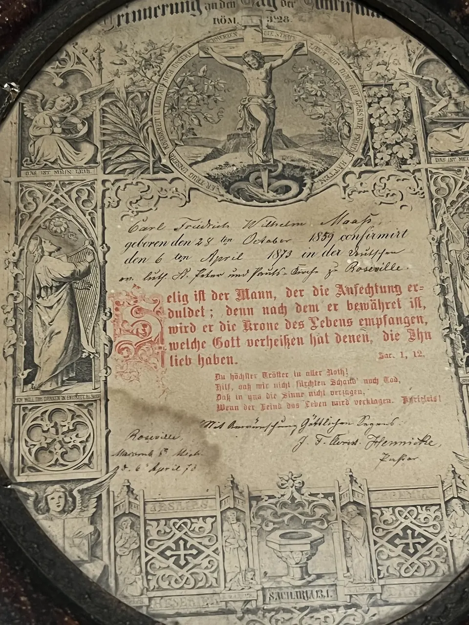 An 1873 German Lutheran confirmation certificate, lithographed and filled in by hand, in an oval frame