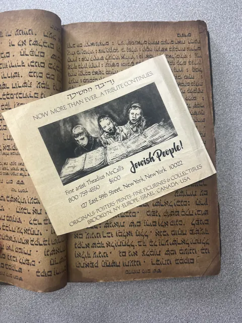A printed dealer advertisement headed Jewish People, showing three children reading a large open book, lying across the open Syriac book